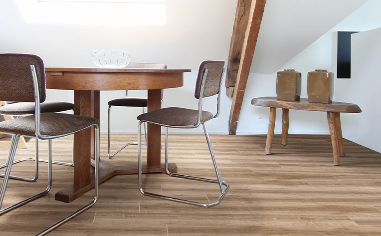 laminate flooring in a small desk area with chairs