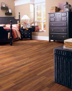 bedroom laminate flooring - bed - dresser - large window