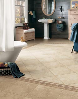 bathroom tile flooring - sink with mirror above it - bathtub