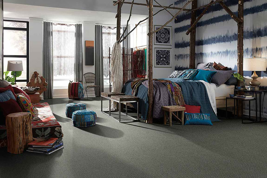 Bedroom with natural furniture look and wallpaper with blue lines made from a seismograph